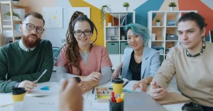 A diverse group of professionals collaborating in a modern office setting, showcasing teamwork.